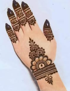 hendi design on the palm of a woman's hand, with intricate designs