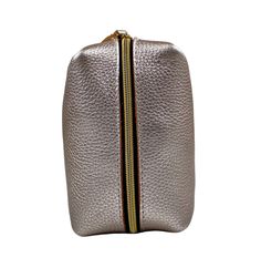 Features: Gold Zipper Minimalist Kerry Noël branding Dimensions: 7.5" Long 4.5" Wide 4" High Leather. This zippered cosmetic bag is handcrafted from metallic top-grain leather that has a smooth, small pebble grain texture, supple temper, and nice flexibility. Featuring a uniform Metallic Platinum Gold color that has been drum dyed, this leather is extremely durable and resistant to water and moisture. Leather Pouch With Zipper Closure Rectangular Case, Leather Rectangular Pouch With Zipper, Leather Rectangular Pouch With Zipper Closure, Luxury Leather Cosmetic Bag With Zipper Closure, Leather Rectangular Cosmetic Bag With Zipper, Leather Rectangular Cosmetic Bag, Modern Leather Cosmetic Bag With Zipper Closure, Luxury Leather Cosmetic Bag With Zipper, Luxury Leather Zipper Cosmetic Bag