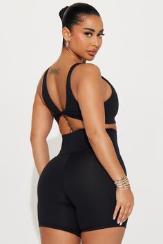 Available In Black, Hot Pink, And Lavender. Active Romper Super Soft Scoop Neck Sleeveless Front Cut Outs Twist Back Detail Padded Medium Impact Body: 77% Polyester 23% Spandex Inner Mesh: 82% Nylon 18% Spandex Imported | Rotation Super Soft Active Romper in Black size Small by Fashion Nova Versatile Elastane Sports Bra, Black Compressive Sleeveless Crop Top, Black Sports Bra With Built-in Bra, Black Sleeveless Crop Top For Pilates, Black Sports Bra With Built-in Bra, Elastane, Black Sports Bra With Built-in Bra Made Of Elastane, Black Elastane Sports Bra With Built-in Bra, Fitted Black V-neck Sports Bra, Sleeveless Elastane Activewear With Medium Bust Support