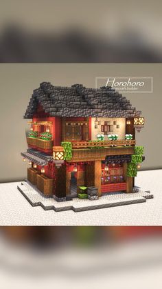 a small house made out of legos on top of a white surface with the words horchro written above it