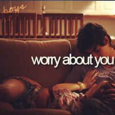 a man and woman sitting on a couch with the words worry about you over them