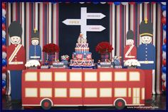 a table topped with a cake covered in red, white and blue decorations