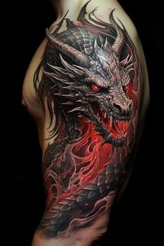 a man's arm with a dragon tattoo on it and red flames coming out of the back