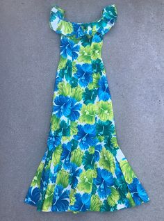 "A beautiful floral dress hailing from Honolulu, Hawaii. Estimate Size: XS Brand: Hawaiian Casuals by Stan Hicks Length: 55\" Bust: 32\" Waist: 25\" Hip: 33\"" Vacation Vintage Fitted Dress, Vintage Fitted Dress For Vacation, Hawaiian Clothes, Blue Mermaid Dress, Dress Hawaiian Style, Hawaiian Wear, Tahitian Dance, Island Style Clothing, Vintage Hawaiian Dress