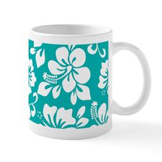 a blue and white coffee mug with flowers on it