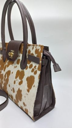 Gorgeous Tote Bag | Brown And Tan handbag - 100% genuine leather - Real cowhide - Detachable long shoulder leather strap- Inner pockets - Top handle - Tan and brown color - Flap and zipper closure Dimensions: Height x Depth x Width x Handle drop 10.5" x 4.5" x 13.5" x 6" Brown Shoulder Bag With Detachable Handle For Business, Brown Business Shoulder Bag With Detachable Handle, Luxury Handheld Brown Satchel, Luxury Brown Handheld Satchel, Luxury Brown Double Handle Shoulder Bag, Luxury Brown Shoulder Bag With Adjustable Strap, Brown Business Satchel With Handles, Brown Handheld Shoulder Bag With Leather Handles, Brown Business Shoulder Bag With Handles