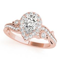 a rose gold engagement ring with an oval center surrounded by round brilliant cut diamond accents