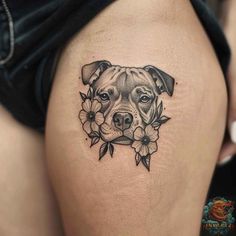 a dog's head with flowers on the thigh