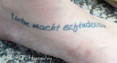 a person with a tattoo on their foot that says, liee macht effitations