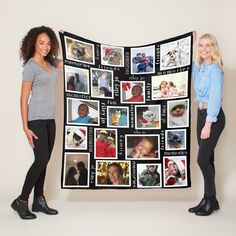 two women standing next to each other holding up a blanket with pictures on it and smiling at the camera