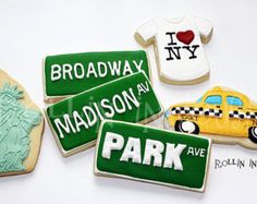 some cookies are decorated with the names of different countries and cities, including the statue of liberty