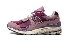 The New Balance 2002R “Protection Pack - Violet” is a purple-based colorway of the lifestyle shoe with an updated, pre-distressed appearance.  Released in 2022, New Balance’s “Protection Pack” of 2002R colorways, like the “Violet,” updates the shoe’s design with exciting new design elements.  Specifically, the shoe features an “unfinished” or “raw” treatment with jagged edges along its Violet suede overlay panels.  A tonal mesh base continues the shoe’s predominantly monochromatic purple vibe.  An ABZORB-cushioned midsole ensures comfort.  Release date: April 2, 2022 Pink And Purple Sneakers, Purple New Balance, New Balance 2002r Protection Pack, 2002r Protection Pack, Ugg Ultra Mini, Nike X Travis Scott, Zapatillas New Balance, Pretty Sneakers, New Balance 2002r