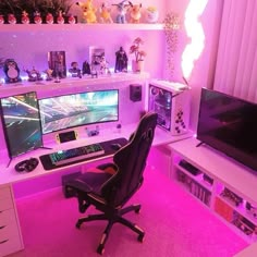 a computer desk topped with two monitors and a keyboard