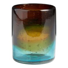 a brown and blue glass vase sitting on top of a table