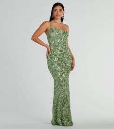 Get a luxe look for your next fancy night out in the stunning Meredith sequin formal dress. She features a sleeveless bodice, an asymmetrical one-shoulder neckline with dual adjustable spaghetti straps, and a back zipper and hook and eye closure. She has a floor-length, form-hugging mermaid silhouette to highlight your curves. The dress is composed of a sheer mesh fabric with an all-over gorgeous sequin embroidered floral design and includes a stretchy knit lining. Complete your outfit with rhin Elegant Sequin Dress For Prom Season, Elegant Sequin Dress For Prom And Homecoming, Elegant Sequin Dress For Homecoming And Prom, Elegant Homecoming Sequin Dress, Elegant Sparkling Sequin Dress For Homecoming, Elegant Homecoming Dress With Contrast Sequin, Elegant Sparkling Sequin Homecoming Dress, Elegant Embellished Sequin Dress For Homecoming, Elegant Homecoming Contrast Sequin Dress