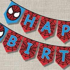 spiderman happy birthday banner on a table