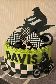 a motorcycle themed birthday cake on a table