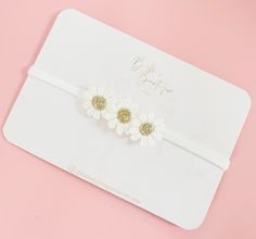 One size soft nylon dainty headband. Small daisies so not overpowering and smallest babies. Follow us on Instagram for fiver Friday deals and new items.  https://www.instagram.com/bellebowtiquehandmade/ Find us on Facebook  Http://www.facebook.com/Bellebowtique-100830351267922/ SAFETY Please use all headbands and clips with adult supervision. DO NOT leave your child unattended while wearing any headband or clip as some may contain small parts which maybe pulled of and cause chocking. Do not let your child nap wearing hair accessories. You assume any and full responsibility for the safety of your child. "Belle Bowtique" offers handmade accessories such as headbands, pigtail bows, christening headbands, lace headbands, boho hair clips, baby girl headbands, birthday headbands, adult headbands Cute White Headband For Birthday, Cute White Birthday Headband, Cute White Hair Accessories With Handmade Flowers, Adjustable White Flower Hair Accessories, Adjustable Handmade Flower Hair Accessories For Gift, Handmade White Headband Hair Accessory, Adjustable Hair Accessories With Handmade Flowers For Gifts, White Adjustable Headband With Handmade Flowers, Handmade White Headband