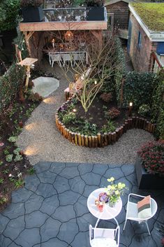 an aerial view of a patio and garden