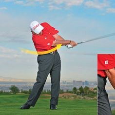 a man hitting a golf ball with a club