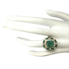 Stamped: 14K Yellow Gold Total Ring Weight: 12.3 Grams Ring Length: N/ARing Width: N/A Gemstone Weight: Total Natural Center Emerald Weight is 3.20 Carat (Measures: 9.00x9.00 mm) Quantity: 1 Color: Green Gemstone Weight: Total Natural Side Emerald Weight is 2.00 Carat Quantity: 12 Color: Green Diamond Weight: Total Natural Diamond Weight is 1.70 Carat Quantity: 42 Color: F-G, Clarity: VS2-SI1 Face Measures: 21.30x18.25 mm Sku: [702540W] Green Cluster Luxury Ring, Luxury Emerald Ring With Accent Stones For Formal Occasions, Formal Multi-stone Halo Ring, Formal Green Gia Certified Cluster Ring, Formal Multi-stone Emerald Gemstones, Formal Multi-stone Emerald Jewelry, Formal Cluster Emerald Ring With Center Stone, Exquisite Green Rings For Formal Occasions, Luxury Green Collectible Rings