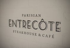 the entrance sign to an entreecote steakhouse and cafe in paris, france