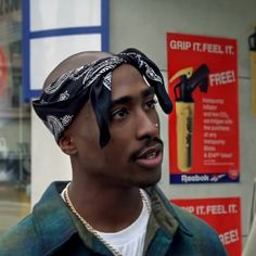 a man with a bandanna around his head