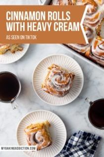 cinnamon rolls with heavy cream are served on tiktok plates and next to coffee