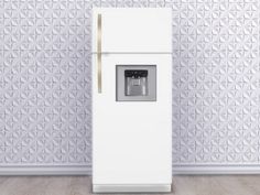 a white refrigerator freezer sitting in front of a wall with geometric designs on it