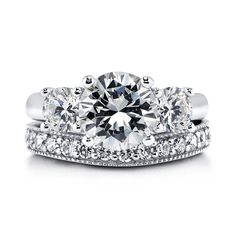 three stone engagement ring set with diamond band