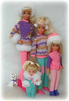 the dolls are all dressed up and posing for a group photo in their christmas outfits