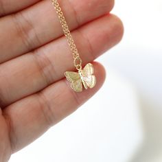 "Beautiful and lovely tiny butterfly necklace in gold color. Made of matte finished dainty butterfly pendant with gold plated skinny brass chain. Soft and warm. Great for gift, everyday or special occasion. Your item will ship in a gift box. Please feel free to contact me if you have any question. ♥ Length 15\" - 20\" ♥ Pendant 1/2\" x 3/8\" ♥ Gold plated over brass ♥ See more Rudiana Accessories Rudiana.etsy.com" Dainty Yellow Gold Butterfly Necklace With Delicate Chain, Dainty Butterfly Necklace In Yellow Gold With Delicate Chain, Dainty Gold Butterfly Charm Necklace, Dainty Gold Butterfly Necklace With Delicate Chain, Dainty Butterfly Necklace With Delicate Chain For Everyday, Delicate Gold Butterfly Necklace, Delicate Gold Butterfly Charm Necklace, Delicate Gold Necklace With Butterfly Charm, Dainty Gold Butterfly Necklace With Charm