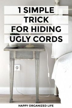 a table with a lamp on it and the words, simple trick for hiding ugly cords