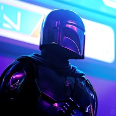 a man in a dark suit and helmet standing next to a neon blue background with the words star wars written on it