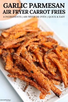 garlic parmesan air fryer carrot fries on a white plate with text overlay