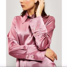 This Pink Nanushka Mandine Western Satin Shirt Features A Point Collar, Exposed Button Fastenings At Front, Long Sleeves, Inverted Pleats At Cuffs, Marbled Buttons & Buttoned Cuffs, V-Shaped Yoke At Back, Inverted Pleat At Yoke, And Curved Hem. Expertly Designed From Satin, This Nanushka Shirt Is Exactly What You Should Be Wearing When You Saddle Up And Ride Into Town. Color: Antique Rose This Piece Fits True To Size.Cut For A Relaxed Fit. Composition: Polyester 22%, Triacetate 78% Nwot. Chic Shirt With Buttons And Spread Collar, Chic Silk Shirt With Buttons, Elegant Long Sleeve Shirt With Snap Buttons, Pink Silk Collared Blouse, Elegant Pink Button-up Shirt, Feminine Long Sleeve Shirt With Button Closure, Elegant Pink Top With Button Cuffs, Silk Collared Shirt With Buttons, Feminine Buttoned Shirt For Fall