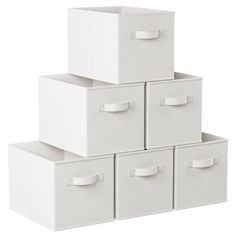 four white storage boxes stacked on top of each other