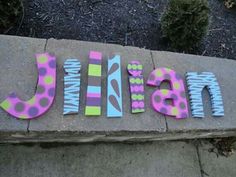 the letters are painted in different colors and sizes