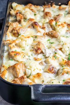 chicken alfredo casserole in a baking pan with the words keto chicken alfredo casserole