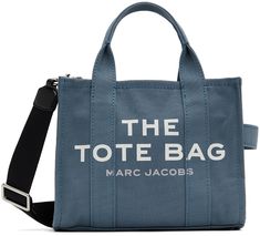 Cotton canvas tote in blue. · Twin rolled carry handles · Detachable and adjustable shoulder strap · Jacquard woven text and logo in white at face · Textile logo patch at back face · Zip closure · Unlined · H8 x W10 x D5 in Supplier color: Blue shadow Blue Tote Bag Outfit, Calm Outfits, Tote Bag Outfit, Blue Tote Bag, Textile Logo, Blue Tote, Mini Tote Bag, Christmas 2022, Mini Tote