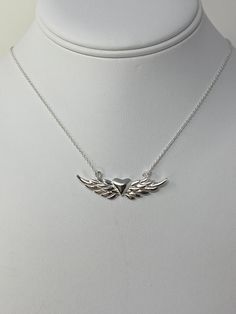 "For a limited time only, we have amazing sale offers! Buy 1 item and get 15% OFF on any product in our catalog! Buy 2 or more items and get 20% OFF on any product in our catalog! 925 Sterling Silver Heart With Wings Necklace. Sterling Silver Angel Wing Necklace. Gift for Her in 16+2 Inches\" ------------------------------------- Pendant Length: L- 1/4 INCH, 10 MM Pendant Width:  W- 1 3/4 INCH, 42 MM Weight:5.4 gram Nickel and Lead Free:YES -------------------------------------  You will receive the item in a gift pouch. This is a beautiful necklace, sure to make you feel special. Treat yourself or give as a gift! Perfect for everyday wear! ------------------------------------- Do Visit our Shop for more jewelry: https://www.etsy.com/shop/InsiaJewelry ----------------------------------  Al Angel Necklace Silver, Sterling Silver Nickel-free Heart Necklace For Valentine's Day, Valentine's Day Sterling Silver Heart Necklace Nickel Free, Silver Angel Wings Necklace, Stamped 925 Necklace For Valentine's Day Anniversary, Silver Sterling Valentine's Day Charm Necklaces, Dark Accessories, Rose Gold Anklet, Essential Jewelry