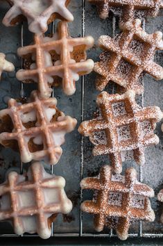 several waffles with icing on a cooling rack