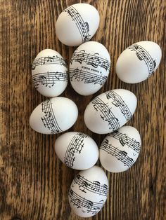 some white eggs with musical notes painted on them