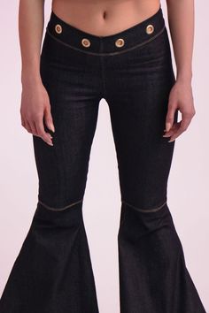 Chance Denim Bell Bottoms Key Features: Dark blue denim Grommet accents at the waistband, back, and bottom flare Zipper detailing at the rear Made in the USA Details: The Chance Denim Bell Bottoms feature dark denim with stitched knee detailing and a dramatic flared cut. Grommets line the waistband and cascade up the flare for a bold, edgy look. Content + Care: Machine wash cold, tumble dry low, no bleach, cool iron only. Size + Fit: The model is wearing a size small. Check our size guide for yo Denim Bell Bottoms, Denim Outerwear, Fly Girl, Edgy Look, Girl Blog, Bell Bottom, Zipper Detail, Dark Denim, Trinidad And Tobago