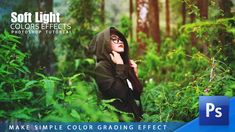 a woman wearing a hoodie is standing in the woods with her hands on her face