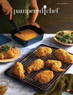 the cover of pampered chef magazine features fried chicken on a baking rack and plates of salad