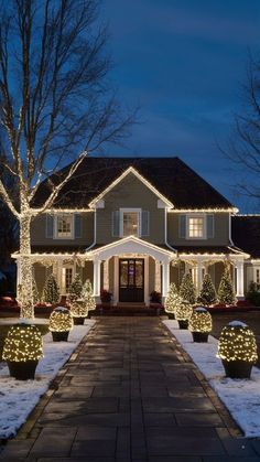 a large house with christmas lights on it