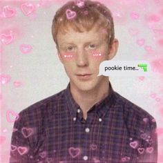 a man with pink hearts on his face and the words pookie time in front of him