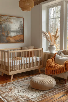 a baby's room with a crib, rocking chair and large painting on the wall