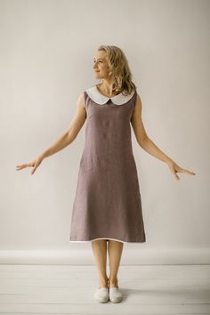 "Our casual sleeveless dress is handcrafted, tailored to the unique body measurements of each customer. We take pride in the fact that no factory processes are involved in its creation. We ensure that every creative and sewing task is fully rewarded. DESCRIPTION This casual sleeveless linen dress has a slight A-line shape, which means it's a bit wider towards the bottom, giving it a flowy feel. The dress has a simple round collar, and it hits just above the knee. There are pockets inside and it Modest Sleeveless Dress, A Line Dress Knee Length, Casual Sleeveless Dress, Peterpan Collar Kurti, Beautiful Casual Dresses Simple, A Line Frocks For Women, Sleeveless Frocks For Women, A Line Dress Designs, Cute Knee Length Dresses